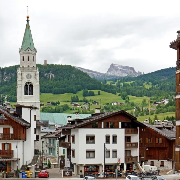 Cortina d'Ampezzo town centre with the campanile and traditional South Tyrolean rooftops backed by the Ampezzo Dolomites