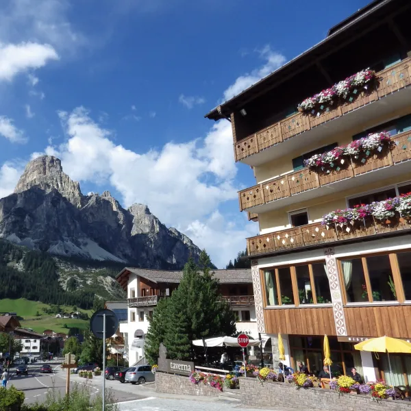 Corvara in Badia in the Ladin Dolomites with the Sassongher rock tower rising directly above the village