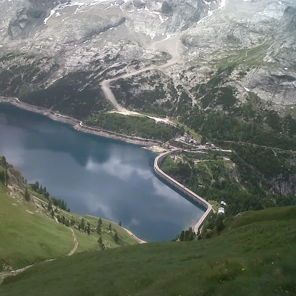 Lake Fedaia and its dam seen from the Viel del Pan