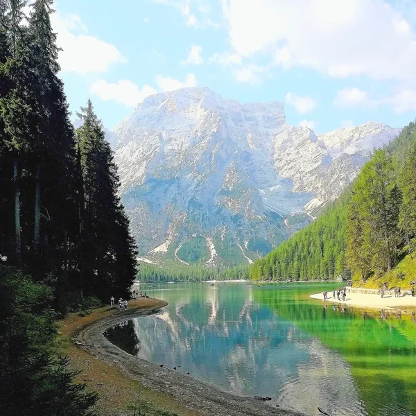 Lago di Braies (Pragser Wildsee) with turquoise water at the base of the near-vertical limestone walls of the Croda del Becco group