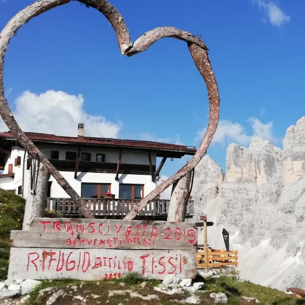 Rifugio Tissi on rocky terrain at the base of the massive Civetta north face
