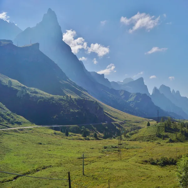 The Pale di San Martino spires above the meadows of Passo Rolle